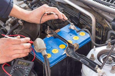 testing a car battery with a meter